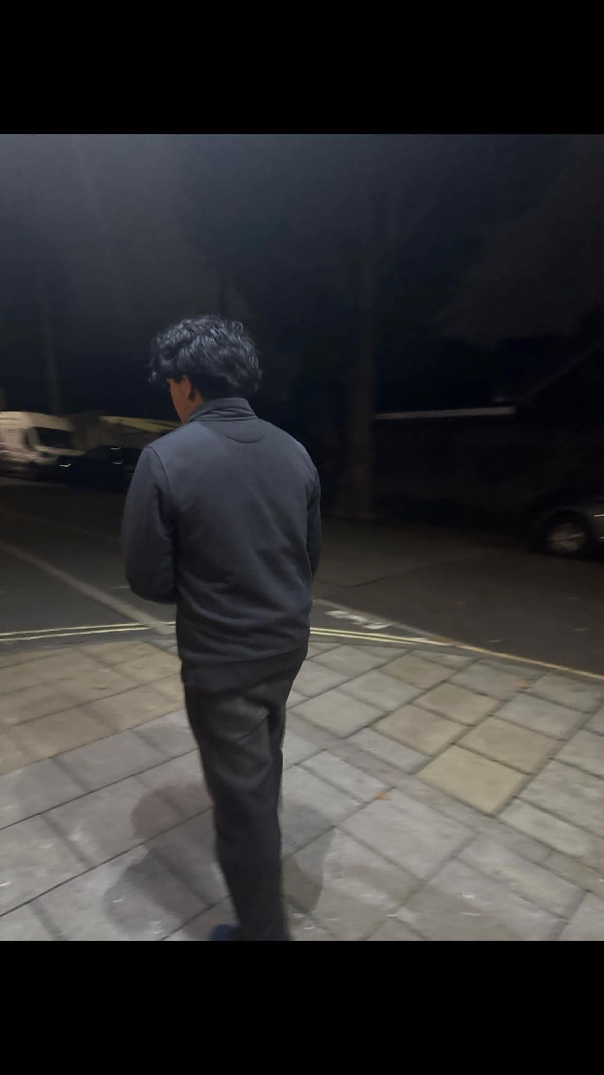 Ash speaking to camera in his study video