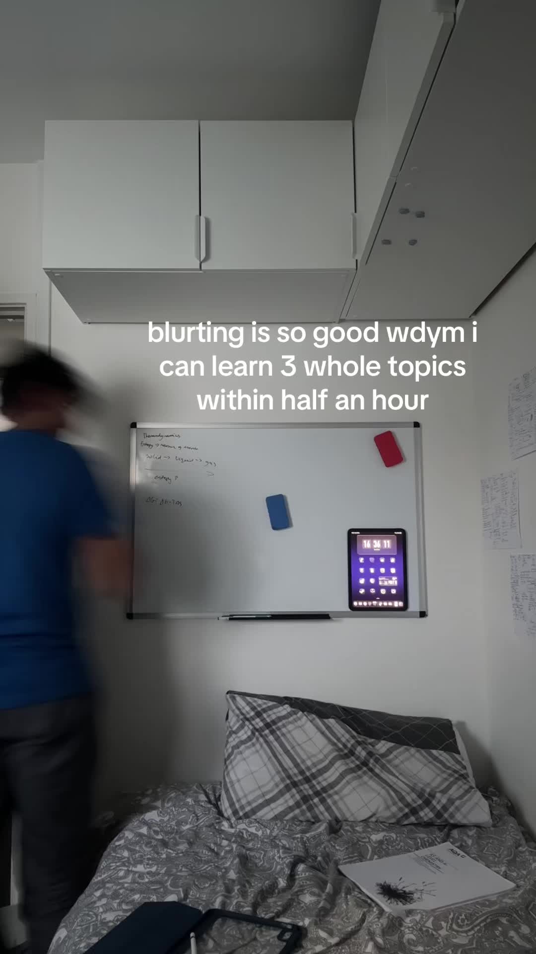 Ash revising with a whiteboard in his TikTok video